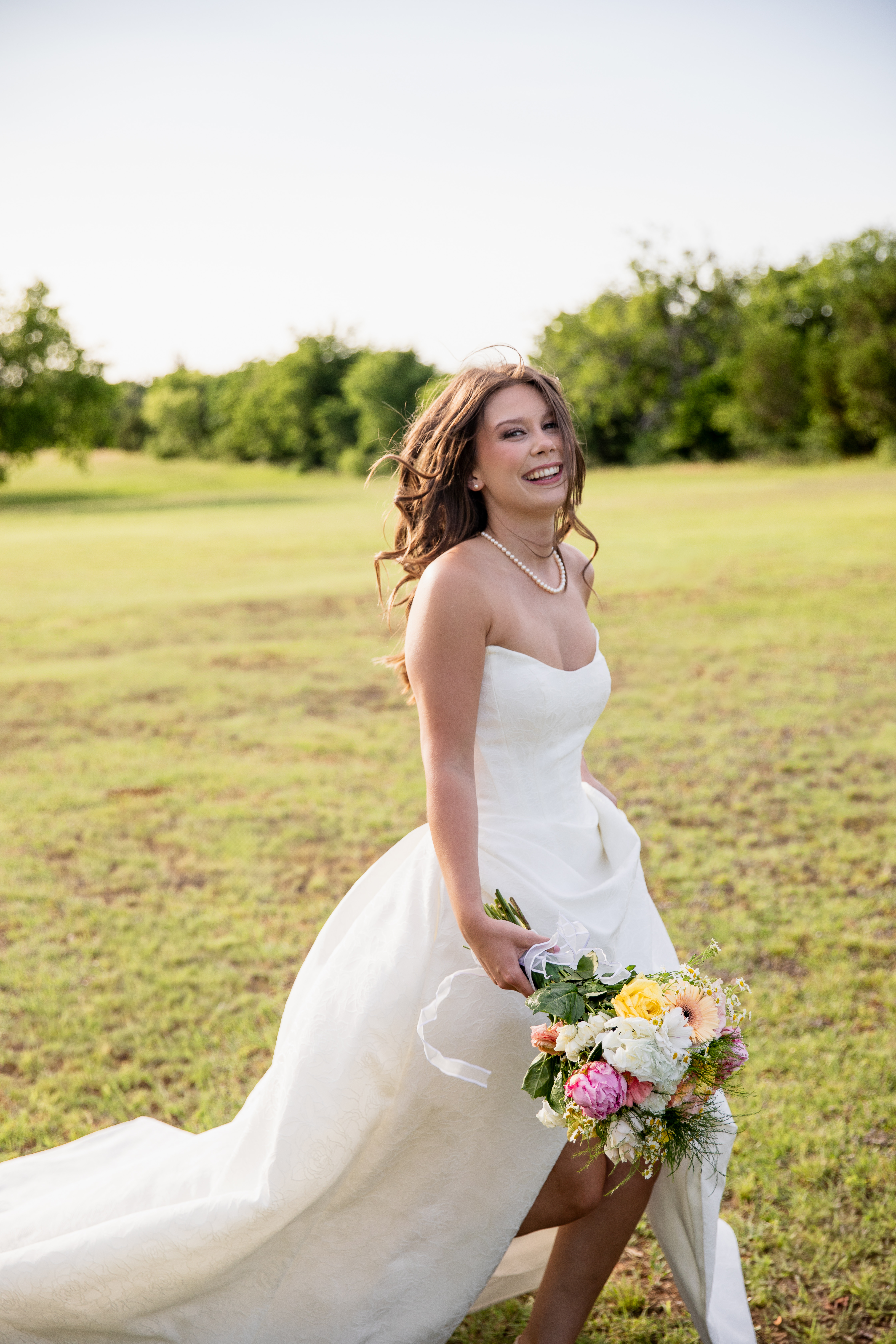 Ashley applying makeup on a bride